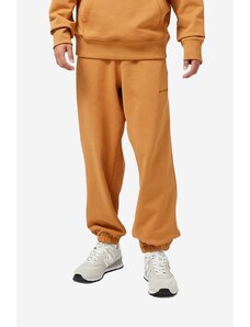 New Balance spodnie dresowe bawełniane kolor pomarańczowy gładkie (puste)