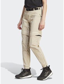 adidas Spodnie dresowe Terrex Utilitas Hiking Zip-Off Tracksuit Bottoms HZ9046 Beżowy Regular Fit